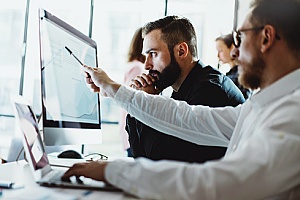 two employees working to perform risk management