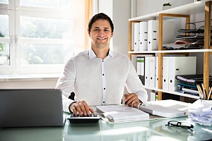 Business man sitting at desk 